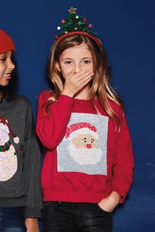 dziewczynka w swetrze z kolekcji świątecznej next
