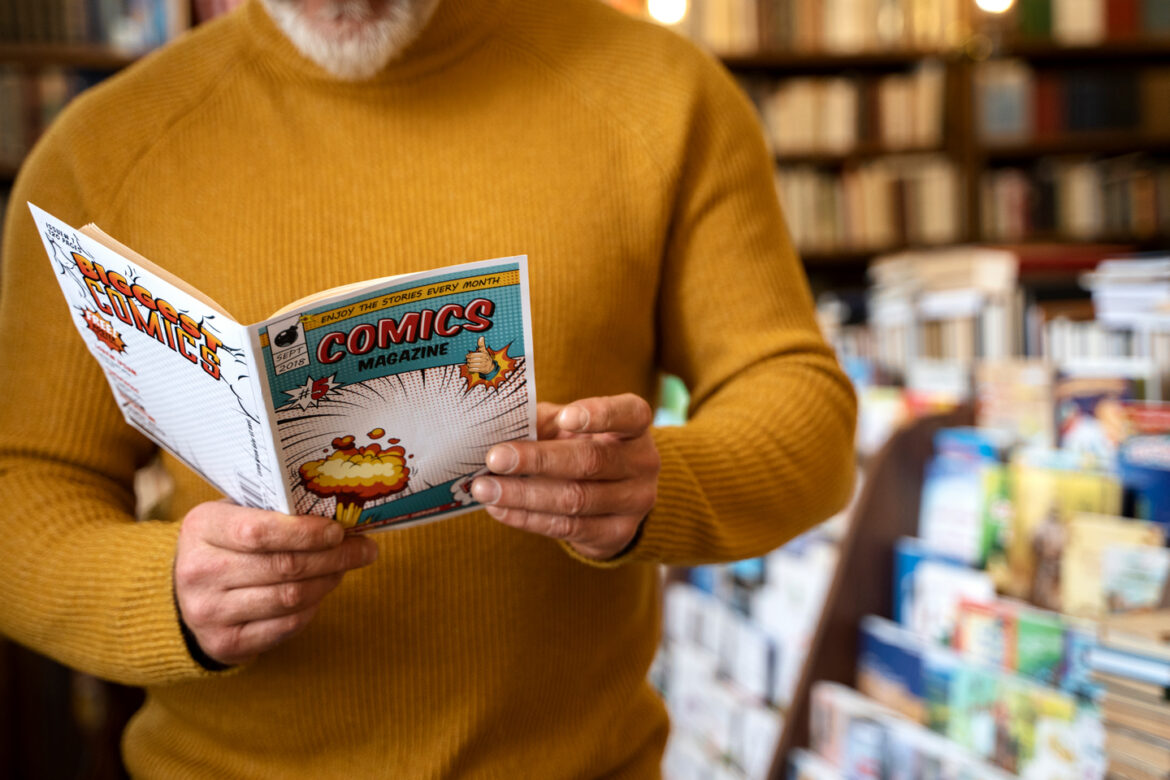 front-view-senior-man-reading-comics